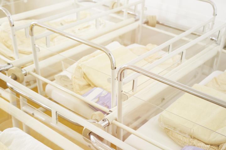 Empty cribs in a maternity ward.
