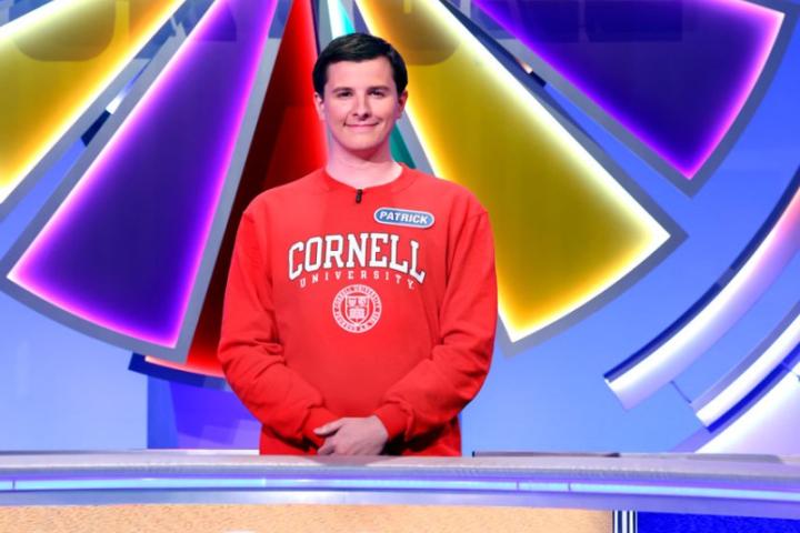 Patrick Mehler standing in front of the wheel on Wheel of Fortune.