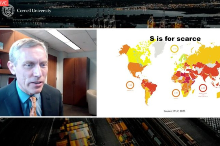 A screen shot of Alex Colvin during a global supply chain webinar