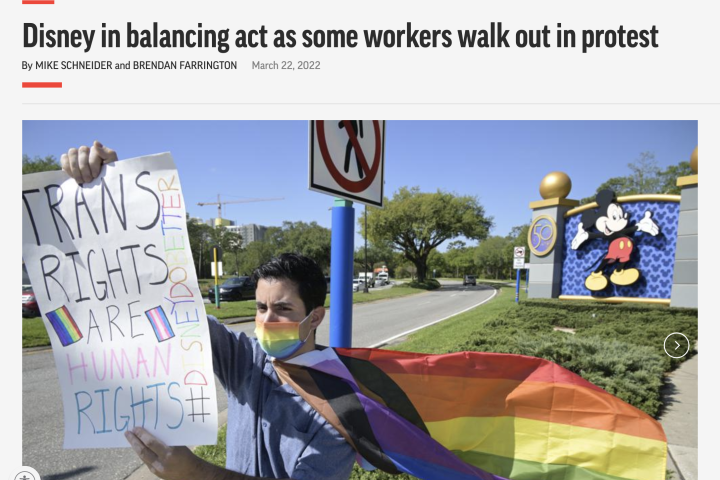 Disney cast member Nicholas Maldonado protests his company's stance on LGBTQ issues, while participating in an employee walkout at Walt Disney World, Tuesday, March 22, 2022, in Lake Buena Vista, Fla.