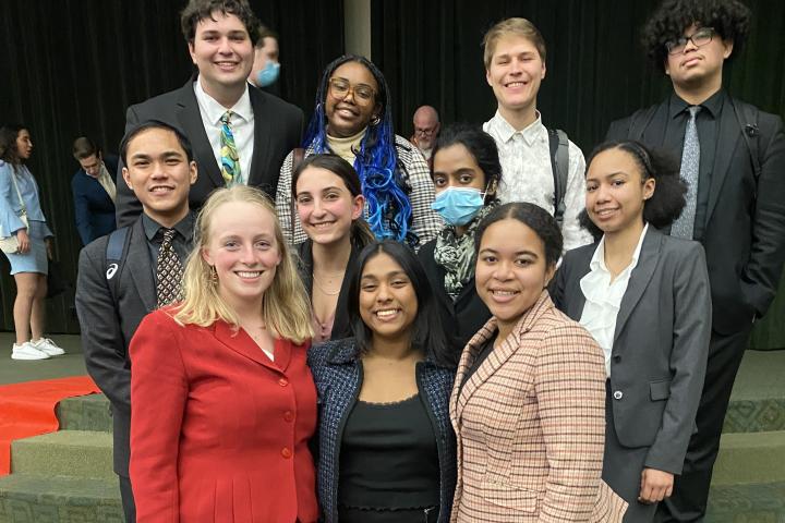Students stand in a group after a speech tournament