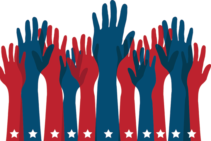 Blue and red hands raised to vote