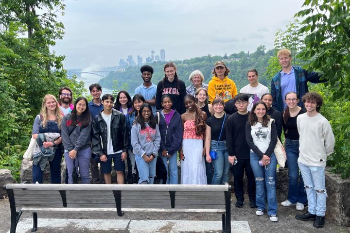 High Road Fellows stand with Niagara Falls and Canada in background