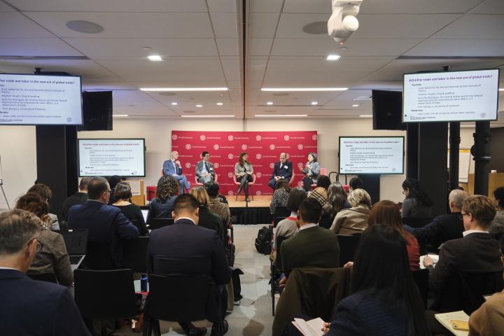 People attend and watch a panel discussion at the 2025 GLI Conference in New York City