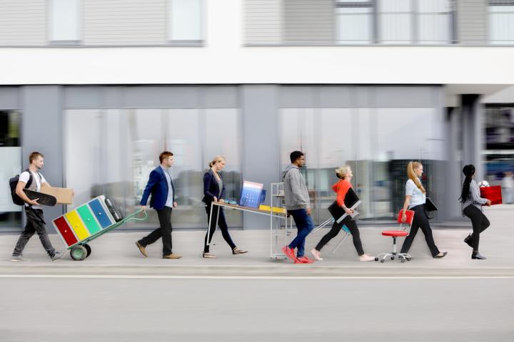 A group of workers move offices