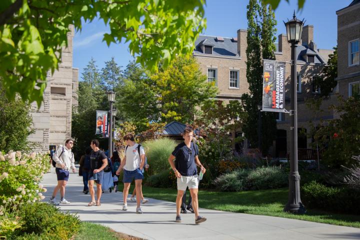students walking through ILR campus courtyard in summer