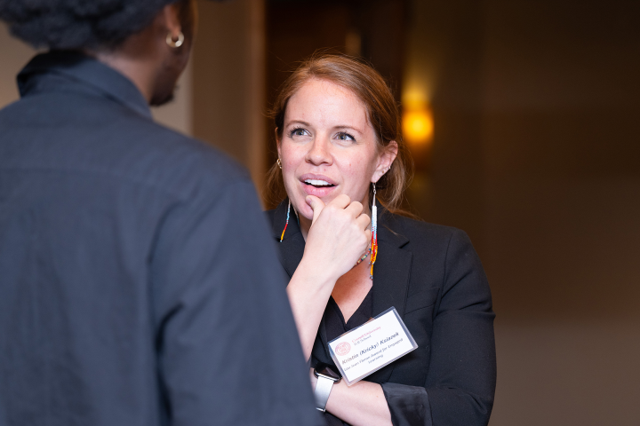 Kricky Ksiazek, M.P.A. ’13 speaks with a student at the McPherson Awards ceremony. 