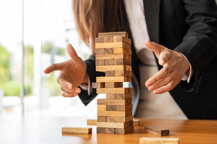 jenga representing management shift