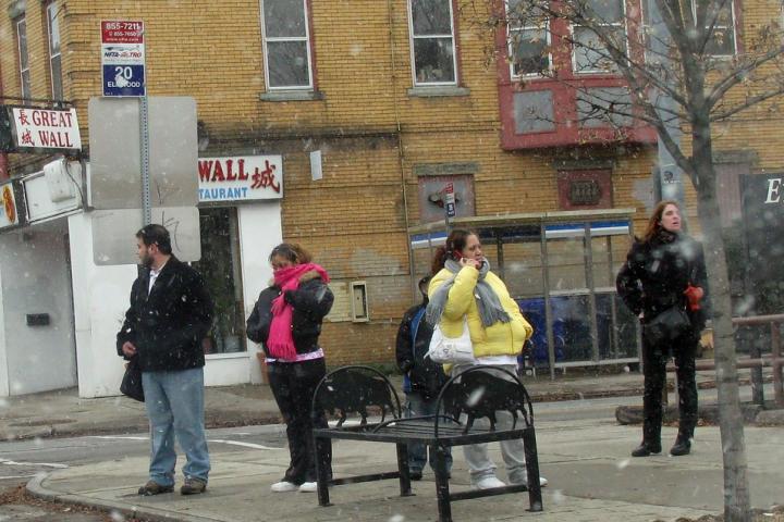 People waiting at a bus stop in Buffalo, NY