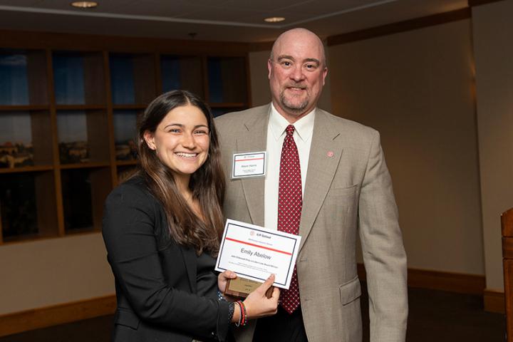Emily Abelow receives the John O'Donnell Prize in Labor Law from Kevin Harris, the Frank B. Miller Director of ILR Student Services.