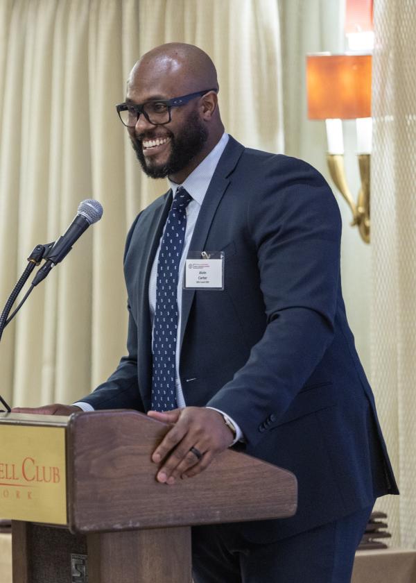 Alvin Carter speaking behind a lectern