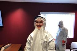 This photo shows the proper personal protective equipment, minus the mask, that one would wear during lead safe work on home RRP projects under EPA guidelines.