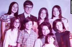 Aging photo from the 70s of a family of 9